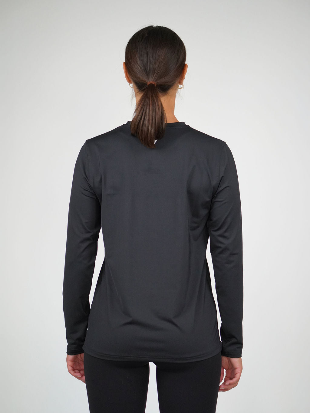 Kvinna i Performance Long Sleeve från Humble Athletics