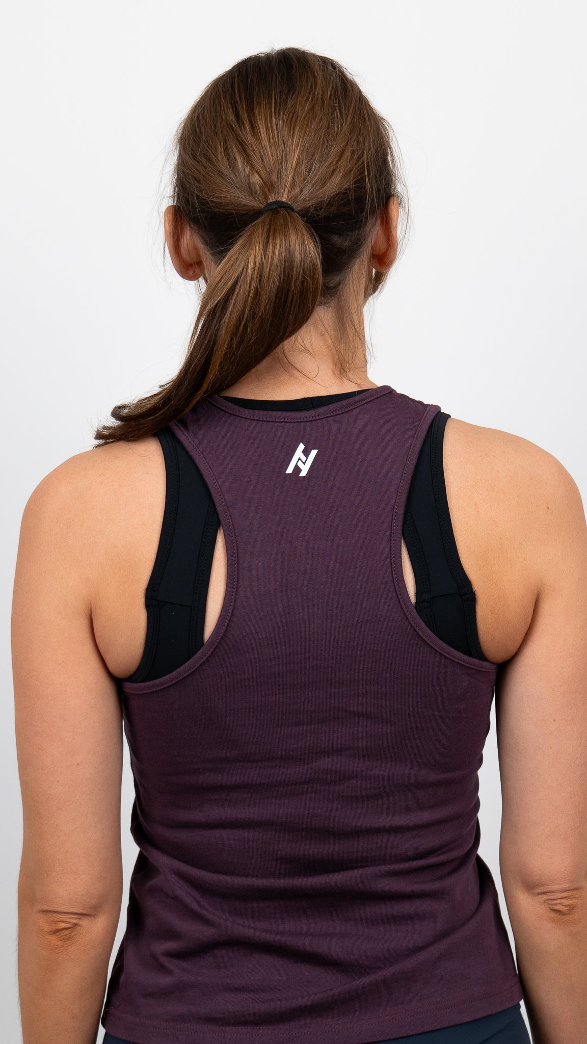 Linne i lila färg med racerback för dam som passar perfekt till löpning, Crossfit och Hyrox